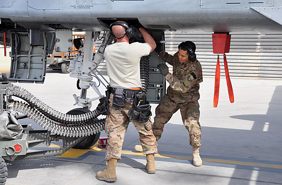 Munitions systems airmen load foot-long 30 mm slugs into an A-10's GAU-8/A Gatling gun at Bagram Air Base, Afghanistan. (U.S. Air Force photo via DVIDS)