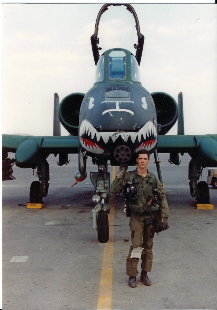 Marks stands alongside his favorite feature of the A-10, its 7-barrel 30 mm cannon, as a 1st Lieutenant during Desert Storm. Marks is famed for destroying a record 23 Iraqi tanks in one three-mission day on February 25, 1991. (Photo courtesy Lt. Col. John Marks)