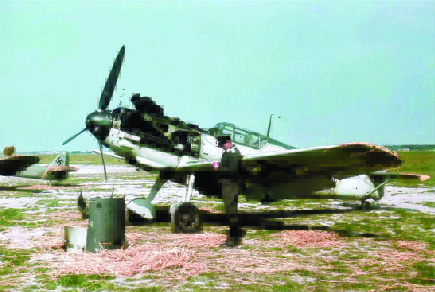 Bf 109E-4 “White 13+1,” flown by Lt. Walter Blume of 7.JG26, undergoing maintenance at Caffiers airfield, near Calais, France during the summer of 1940. A bullet hole in the engine cover sitting on the ground indicates that the 109 has been damaged in combat. A technician is examining the damage. Lt. Blume was shot down over England, injured and became a POW on August 18, 1940. (Photo by Hauptmann Rolf Schödter via author’s collection)